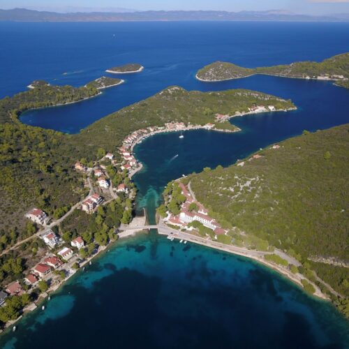 Ariel picture of Island Lastovo, red rooftops, greenery, blue sea