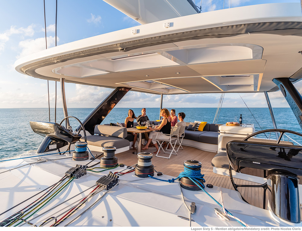 Luxury Sailing Catamaran Lagoon 65, with three crew members, is sailing on the Adriatic coast.
