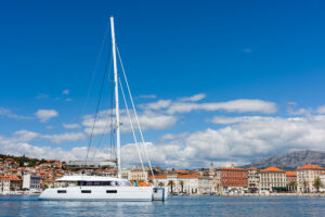 The best of Croatia luxury catamaran sailing in front of the town Split.